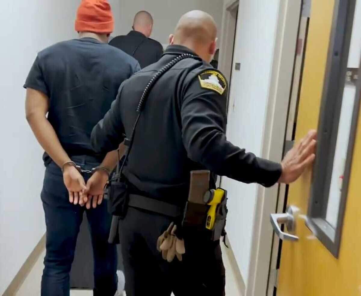 In a photo released by the Sacramento County Sheriff’s Office, Demetrius Davis is led away in handcuffs at a sheriff’s substation April 26, 2022. Davis on Friday Aug. 28, 2026, was convicted of using social media to lure children into performing sexual acts in an investigation that identified more than 80 victims throughout the United States.